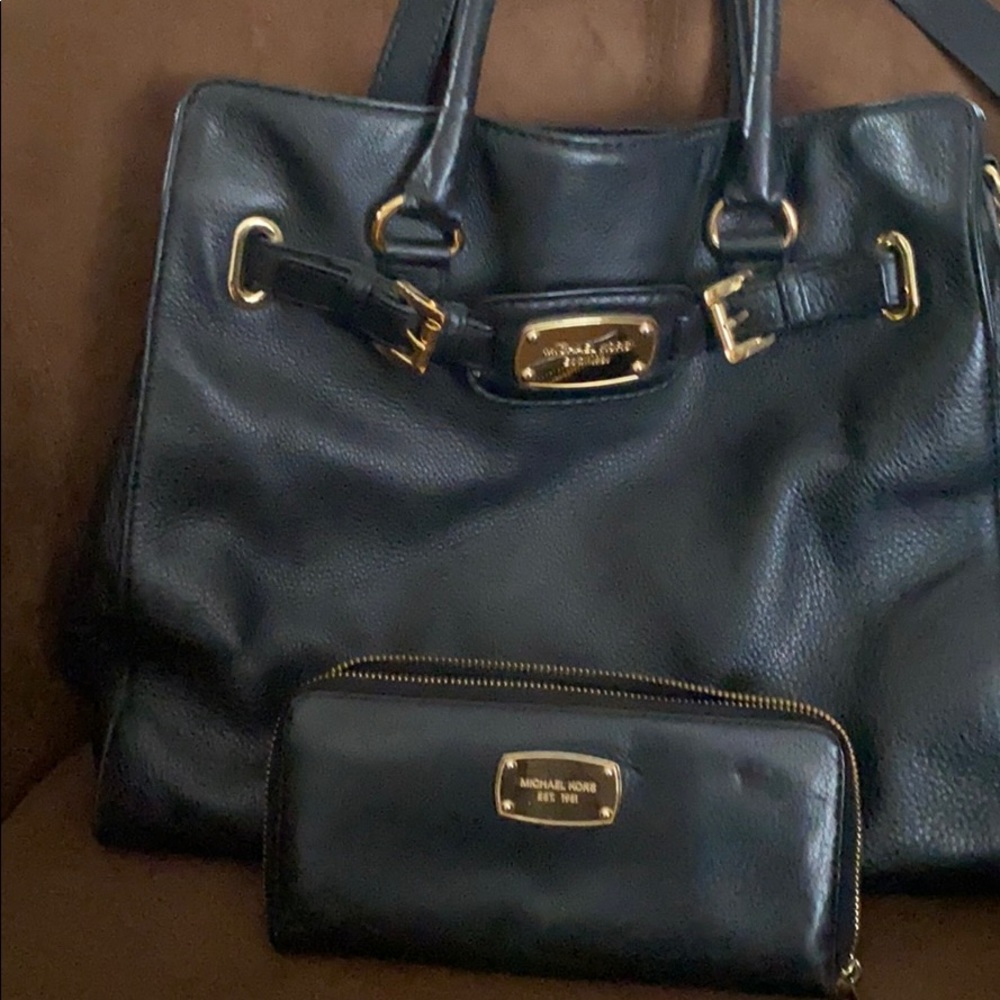 Black leather shoulder bag with matching wallet